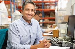 man sitting at computer