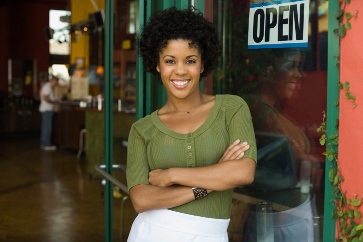 lady standing in front of business
