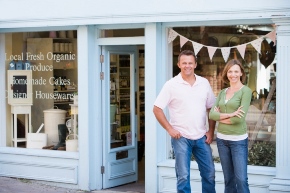 couple standing in front of business