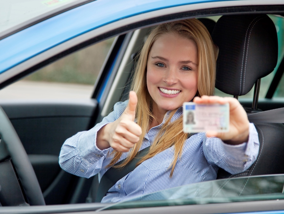 girl smiling with drivers licence