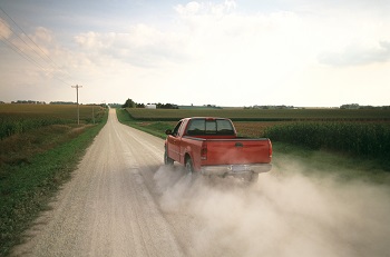 Pickup Truck On Dusty Road